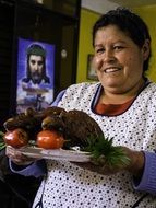 Woman with guinea pigs in the Peru