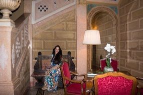 a woman on the victorian furniture