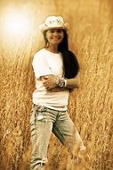 country girl on the background of a wheat field