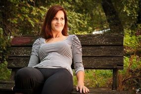 beautiful woman on a park bench