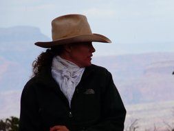 horsewoman in a cowboy hat in profile