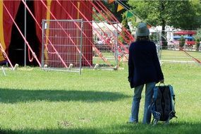 photo of the woman is near the circus tent