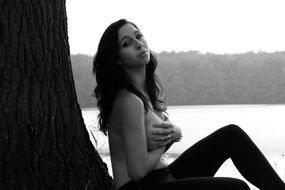 erotic woman near the tree