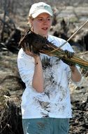 helping woman on a farm
