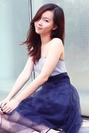 Nice girl posing in trendy dress
