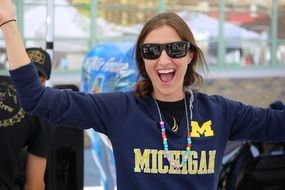 Happy woman excited in black sunglasses