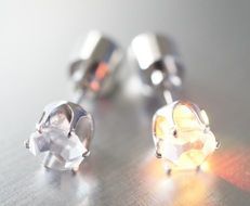 silver earrings with luminous stones