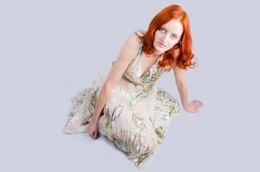 red haired woman in beautiful dress