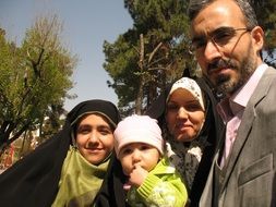 family selfie on the street