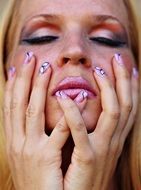 bright make-up and nails of a woman