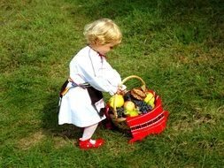 girl in traditional costume with a basket