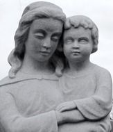 sculpture of a woman with a child