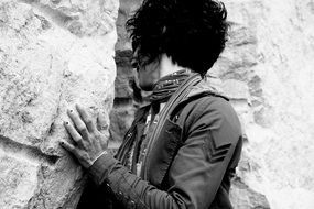 Black and white photo of the woman near the rocks