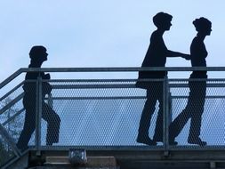 Silhouettes of walking humans