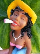 female porcelain figure smoking marijuana