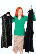 woman choosing dress at white background