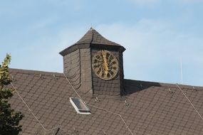 clock on the roof of the hospital