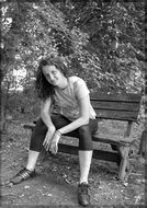 black and white photo bench female woman