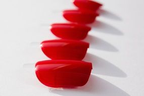 red lacquered fingernails