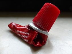red aluminium toothpaste