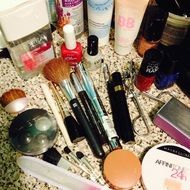 brushes, powder and cosmetics on the table