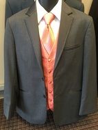 men's suit with a pink tie