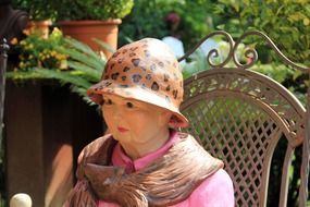 art statue woman with hat