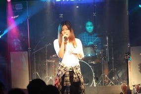 Woman singing at stage