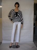 mannequin in clothes near the wall