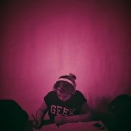 pink picture of a girl with headphones