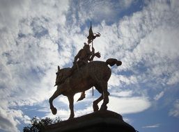 silhouette of the statue of Jeanne dark