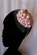 Wedding decoration on the head with a pink pearl and mesh