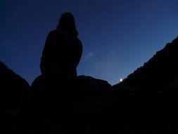 dark silhouette of a woman at night