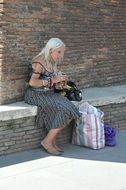 Old loneliness woman with tarot in hands