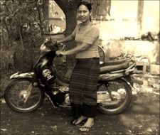 woman and motorbike sepia photo