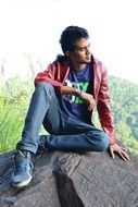 young man siting on the rock in mawanella