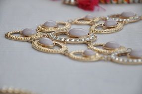 gold necklace on the table