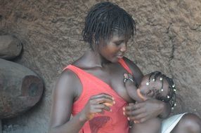 african woman breastfeed baby
