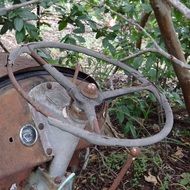 old rusty steering wheel on a tractor