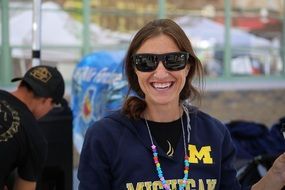 laughing woman in sunglasses