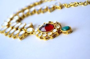 gold jewelry with stones