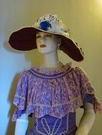 female dress and hat on a mannequin