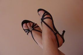 legs in black sandals