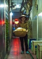 female food vendor in Vietnam
