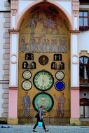 the woman walked about clock monument in czech