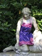 monument of a girl dressed in a colored apron