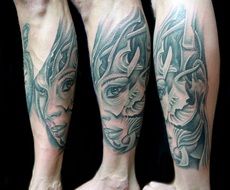 Face tattoo on woman leg
