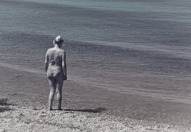 retro photo of a woman on the beach