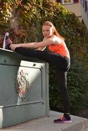 young girl is engaged in stretching