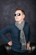 stylish man in sunglasses and scarf